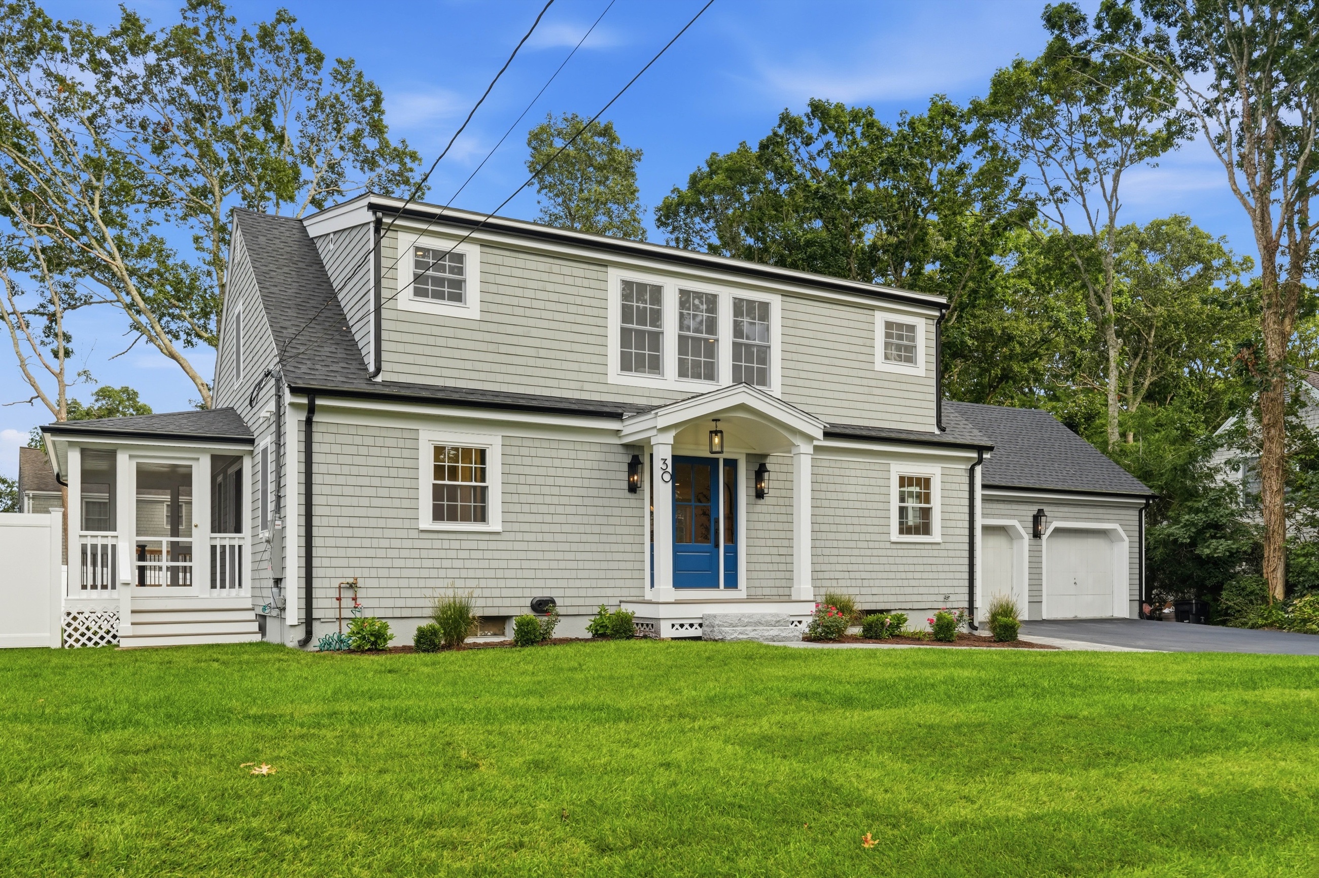 Freshly renovated gray Cape-style home at 30 Deerfield Road