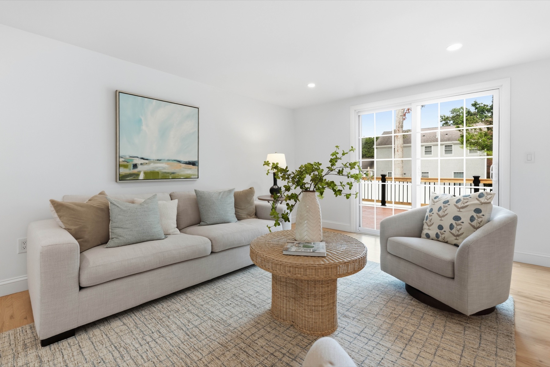 Sunlit living room opening to the rear deck